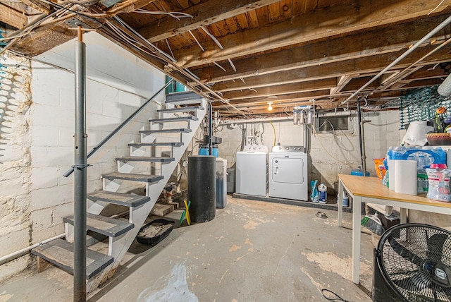 436 Portage St, Grass Lake, MI 49240 - unfinished below grade area featuring separate washer and dryer, stairs, and a water softener system