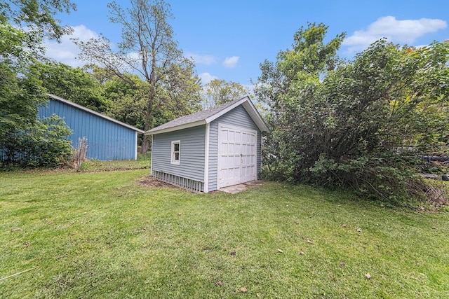 436 Portage St, Grass Lake, MI 49240 - view of grassy yard with a detached garage