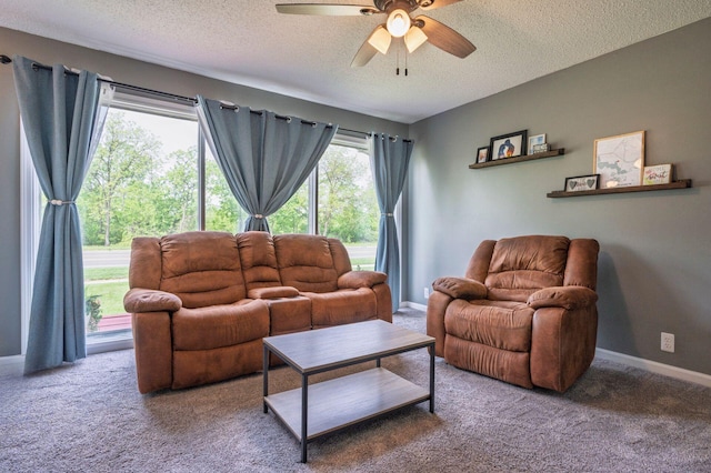 1949 Grove Rd, Ypsilanti, MI 48198 - carpeted living area featuring a textured ceiling, a ceiling fan, and baseboards