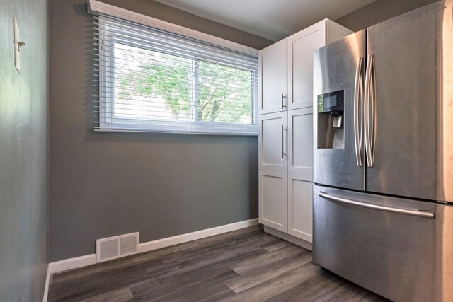 1949 Grove Rd, Ypsilanti, MI 48198 - kitchen featuring stainless steel fridge, white cabinets, baseboards, and dark wood-style flooring
