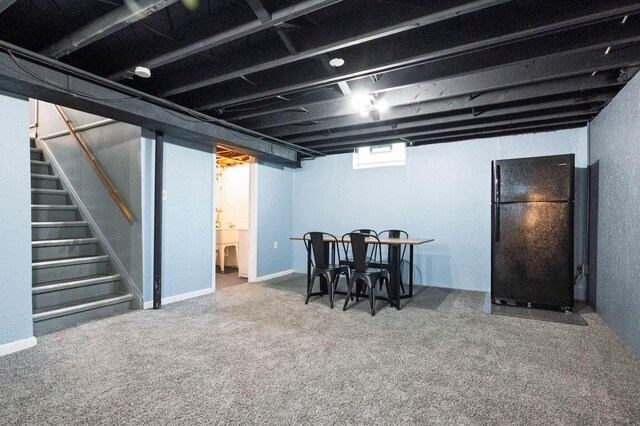 1949 Grove Rd, Ypsilanti, MI 48198 - below grade area featuring freestanding refrigerator, stairway, and carpet flooring