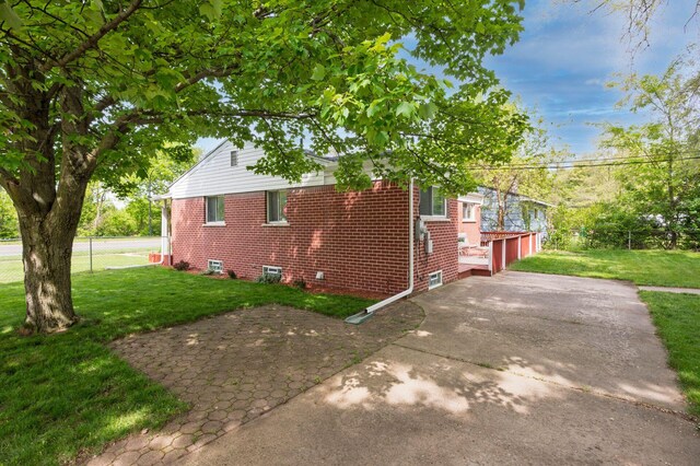 1949 Grove Rd, Ypsilanti, MI 48198 - view of home's exterior with brick siding, driveway, and a garage