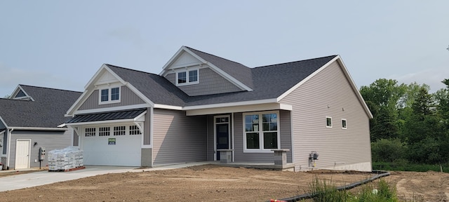 5478 Albright Ave SW Unit 50, Wyoming, MI 49418 - craftsman-style home featuring driveway, a shingled roof, covered porch, and a garage