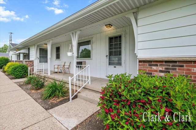 787 Andover St SE Unit 7, Grand Rapids, MI 49548 - doorway to property with covered porch
