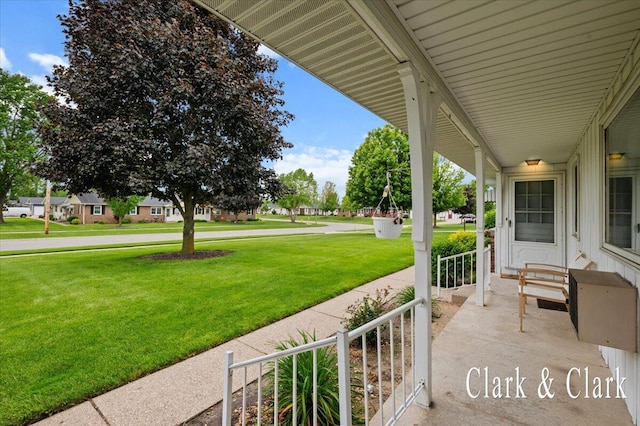 787 Andover St SE Unit 7, Grand Rapids, MI 49548 - covered porch featuring a lawn