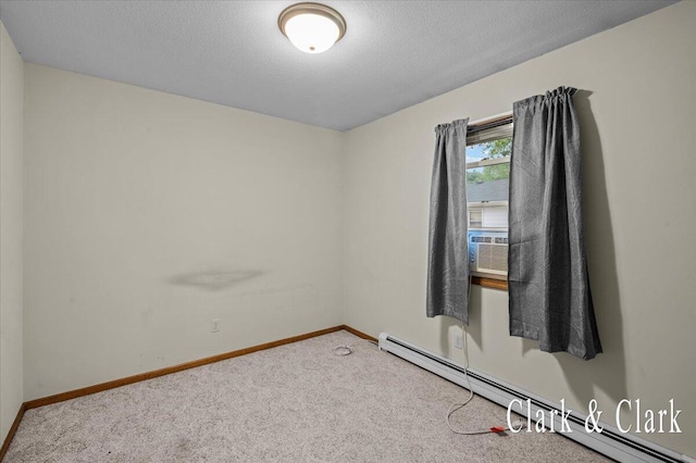 787 Andover St SE Unit 7, Grand Rapids, MI 49548 - spare room featuring a baseboard radiator, carpet floors, baseboards, a textured ceiling, and cooling unit
