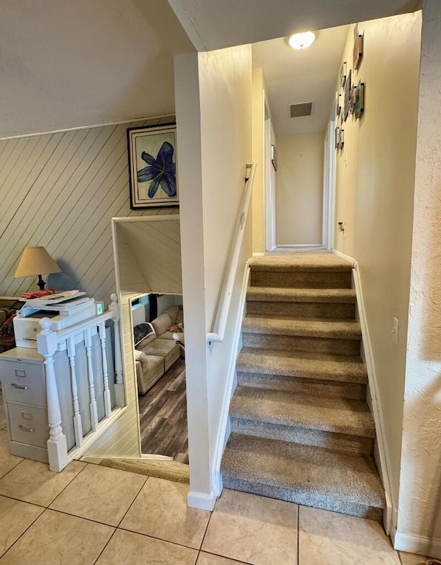 3671 Lido, Highland, MI 48356 - staircase featuring wood walls and tile patterned floors