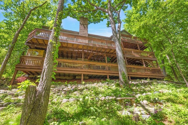 3427 E Dobson Pl, Ann Arbor, MI 48105 - back of house featuring a wooden deck and a chimney