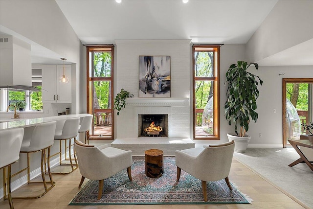 3427 E Dobson Pl, Ann Arbor, MI 48105 - living room featuring baseboards and a large fireplace
