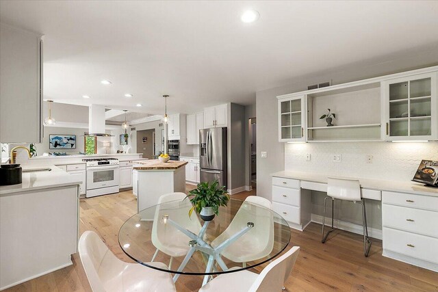 3427 E Dobson Pl, Ann Arbor, MI 48105 - dining space with light wood-style floors and recessed lighting