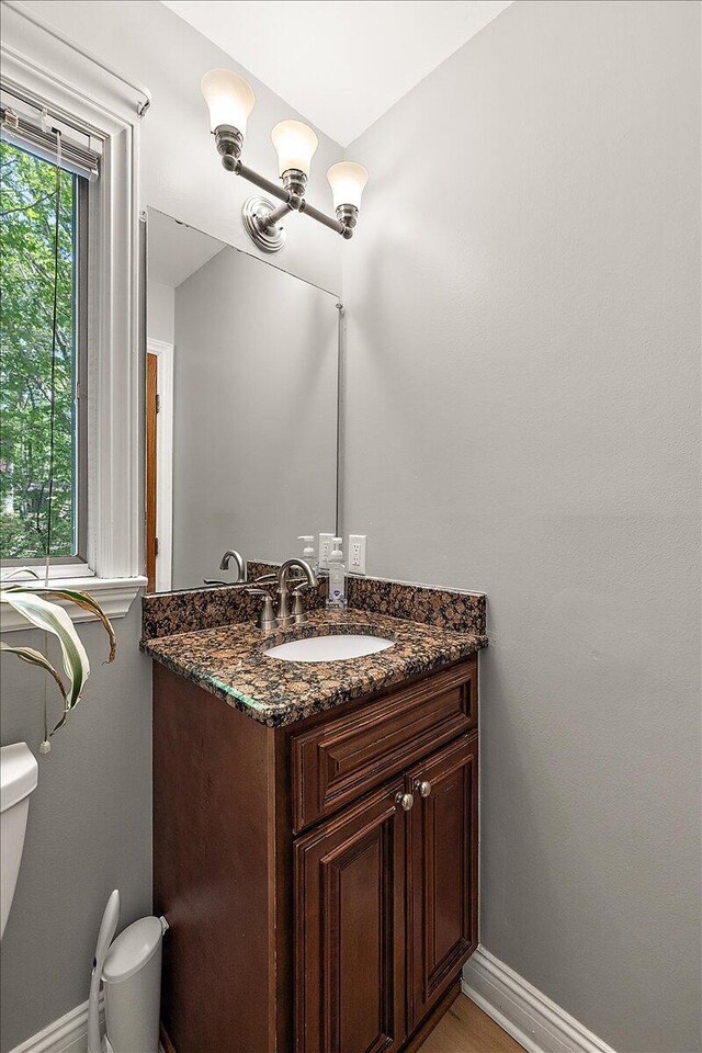 3427 E Dobson Pl, Ann Arbor, MI 48105 - half bath with toilet, vanity, and baseboards
