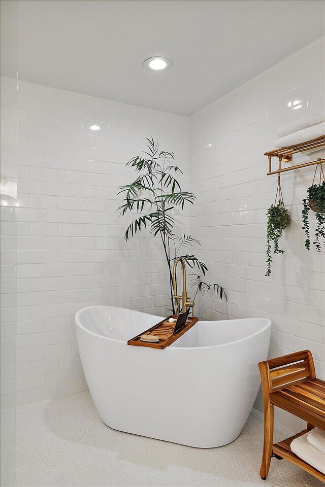 3427 E Dobson Pl, Ann Arbor, MI 48105 - full bath with tile walls, a soaking tub, and recessed lighting