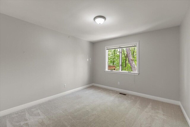 3427 E Dobson Pl, Ann Arbor, MI 48105 - carpeted spare room featuring baseboards