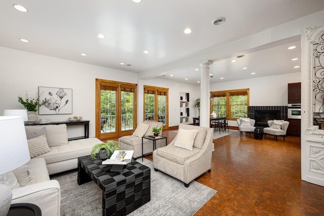 818 S 7th St, Ann Arbor, MI 48103 - living area featuring ornate columns, recessed lighting, and a glass covered fireplace