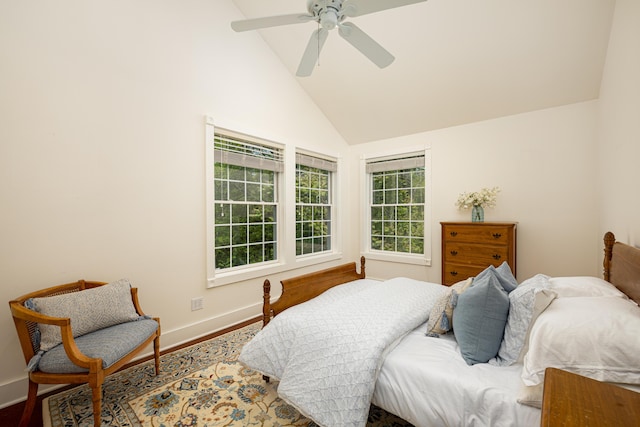 818 S 7th St, Ann Arbor, MI 48103 - bedroom featuring baseboards, high vaulted ceiling, wood finished floors, and a ceiling fan