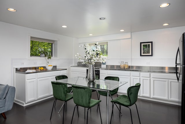 818 S 7th St, Ann Arbor, MI 48103 - kitchen with stainless steel counters, white cabinetry, tasteful backsplash, recessed lighting, and plenty of natural light