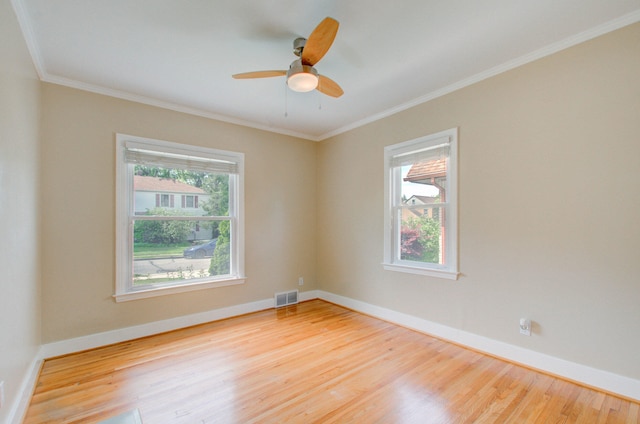 533 Beech St, East Lansing, MI 48823 - spare room with wood finished floors, crown molding, baseboards, and ceiling fan