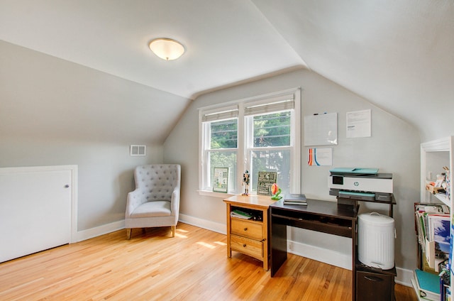 533 Beech St, East Lansing, MI 48823 - home office with wood finished floors, vaulted ceiling, and baseboards