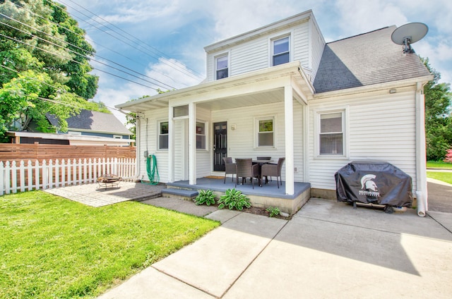 533 Beech St, East Lansing, MI 48823 - view of front of home featuring a patio and a shingled roof