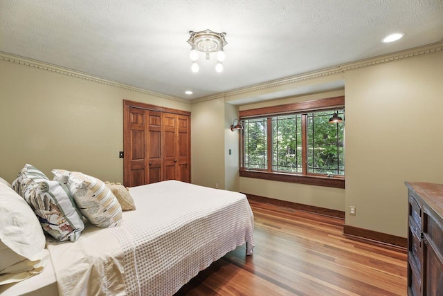 1630 S 3rd St, Niles, MI 49120 - bedroom with a closet, light wood-style flooring, recessed lighting, baseboards, and ornamental molding