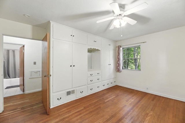 1630 S 3rd St, Niles, MI 49120 - unfurnished bedroom featuring light wood finished floors, baseboards, a closet, and ceiling fan