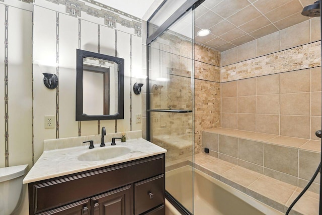 1630 S 3rd St, Niles, MI 49120 - bathroom with vanity, toilet, and bath / shower combo with glass door