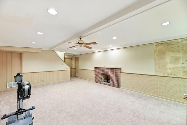1630 S 3rd St, Niles, MI 49120 - unfurnished living room with a wainscoted wall, ceiling fan, carpet, recessed lighting, and a brick fireplace