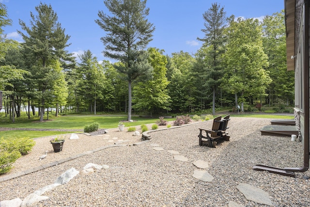6838 E Michillinda Rd, Twin Lake, MI 49457 - view of community with a yard and view of wooded area