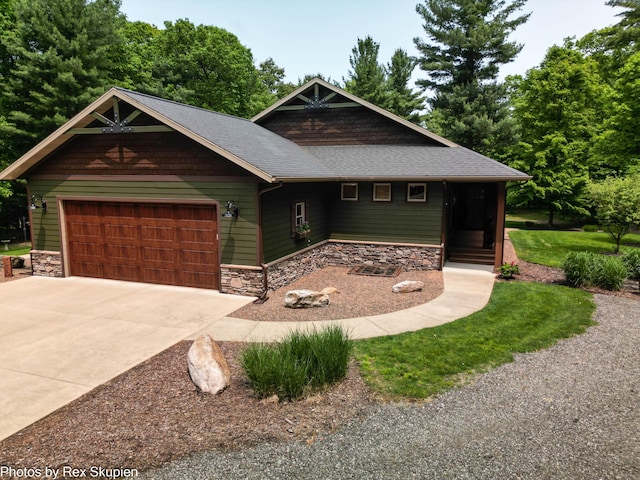 6838 E Michillinda Rd, Twin Lake, MI 49457 - craftsman house featuring stone siding, a garage, driveway, and roof with shingles