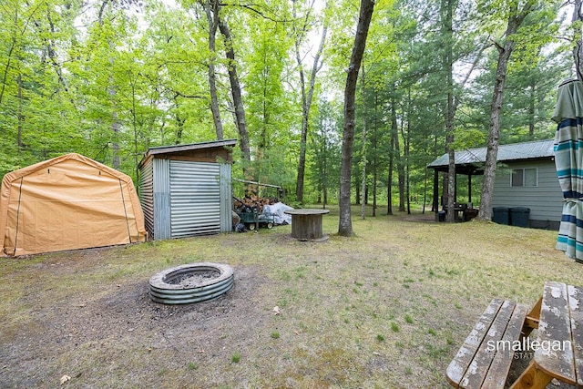 9134 39th Ave, Bitely, MI 49309 - view of yard with an outdoor fire pit