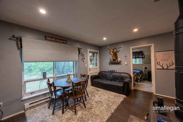 9134 39th Ave, Bitely, MI 49309 - dining space with wood finished floors, recessed lighting, and a baseboard radiator