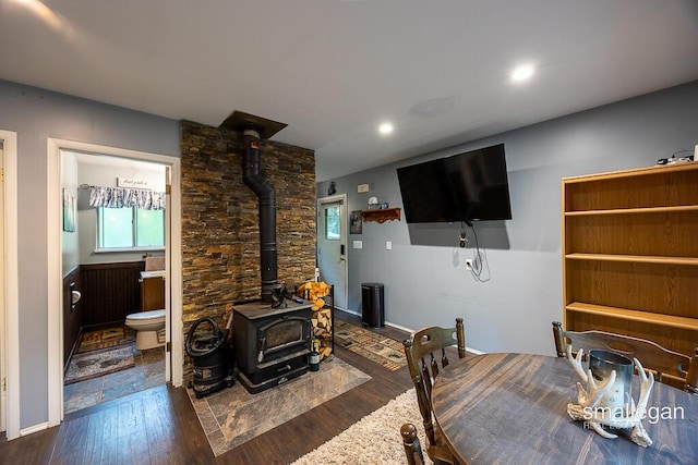 9134 39th Ave, Bitely, MI 49309 - living area featuring a wood stove, wood finished floors, and recessed lighting