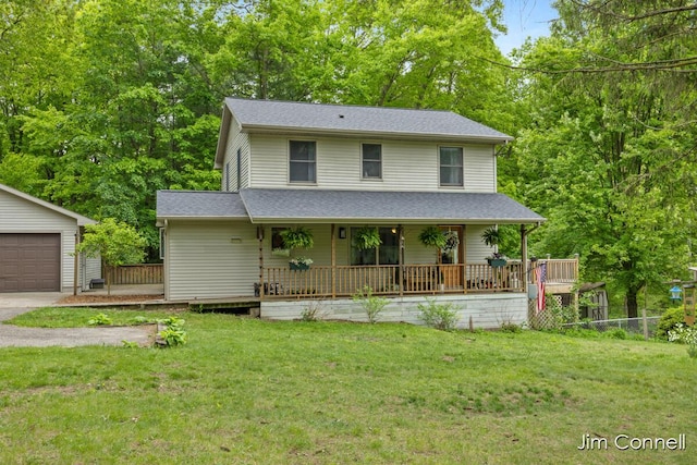 1480 W 72nd St, Newaygo, MI 49337 - view of front of house featuring a front lawn, covered porch, and an outdoor structure