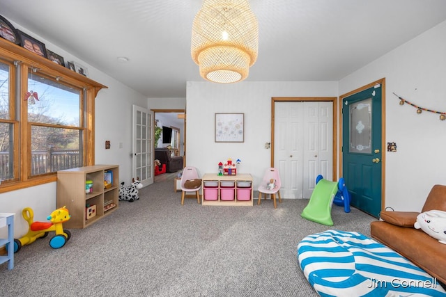 1480 W 72nd St, Newaygo, MI 49337 - playroom featuring carpet flooring and a chandelier