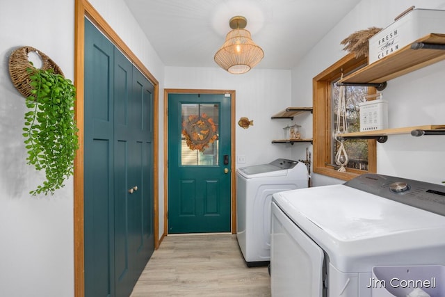 1480 W 72nd St, Newaygo, MI 49337 - laundry area with washer and clothes dryer and light wood-style floors