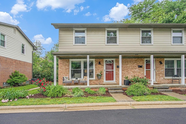 429 S 7th St # 1, Ann Arbor, MI 48103 - traditional-style house with a porch and brick siding