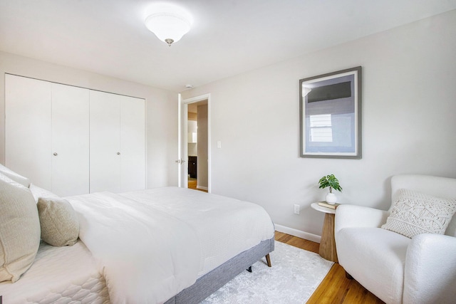 429 S 7th St # 1, Ann Arbor, MI 48103 - bedroom with wood finished floors, a closet, and baseboards