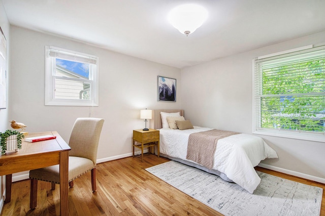 429 S 7th St # 1, Ann Arbor, MI 48103 - bedroom with light wood finished floors and baseboards