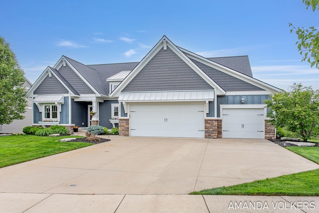 1551 Providence Cove Ct, Byron Center, MI 49315 - craftsman inspired home with stone siding, a garage, board and batten siding, a standing seam roof, and concrete driveway