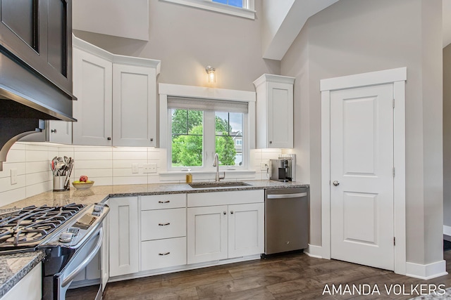 1551 Providence Cove Ct, Byron Center, MI 49315 - kitchen with stainless steel appliances, a sink, white cabinets, and dark wood finished floors