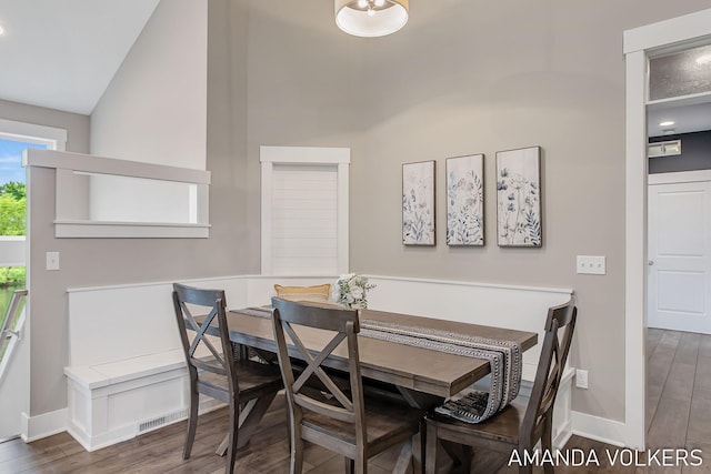 1551 Providence Cove Ct, Byron Center, MI 49315 - dining space with baseboards, wood finished floors, and vaulted ceiling