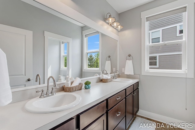1551 Providence Cove Ct, Byron Center, MI 49315 - bathroom with double vanity and baseboards