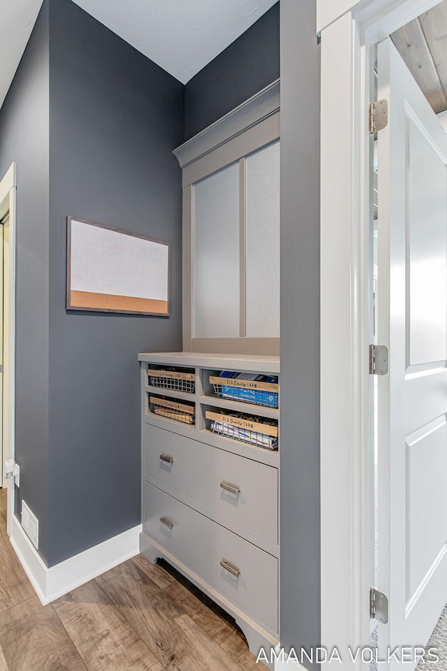 1551 Providence Cove Ct, Byron Center, MI 49315 - detailed view of wood finished floors and baseboards