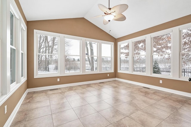 10693 Bear Lake Trl, Portage, MI 49024 - unfurnished sunroom featuring healthy amount of natural light, vaulted ceiling, tile patterned flooring, and baseboards