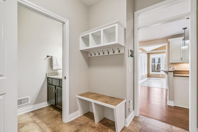 10693 Bear Lake Trl, Portage, MI 49024 - mudroom with light tile patterned floors and baseboards