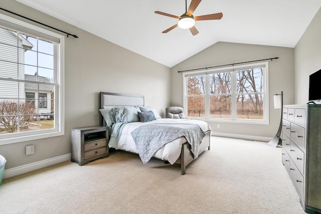 10693 Bear Lake Trl, Portage, MI 49024 - bedroom featuring multiple windows, vaulted ceiling, baseboards, and light carpet