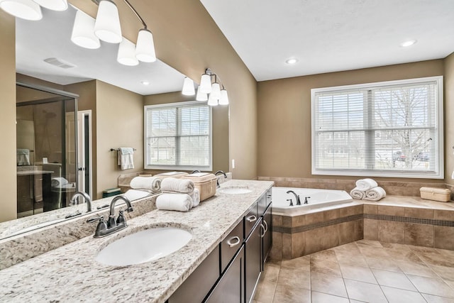 10693 Bear Lake Trl, Portage, MI 49024 - full bath with tile patterned floors, a garden tub, a stall shower, and double vanity