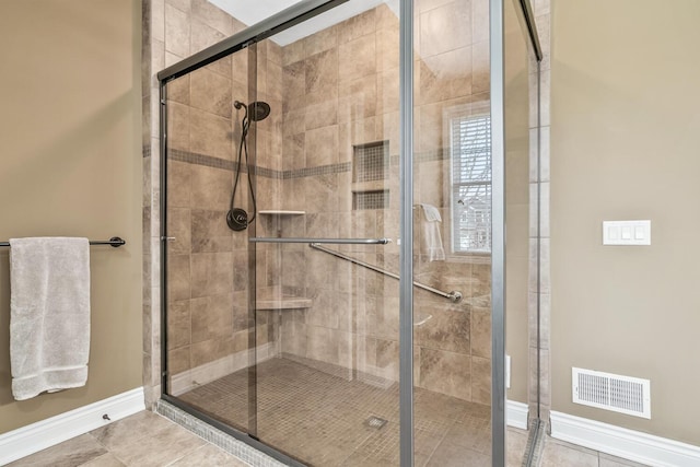 10693 Bear Lake Trl, Portage, MI 49024 - bathroom with baseboards, a shower stall, and tile patterned floors
