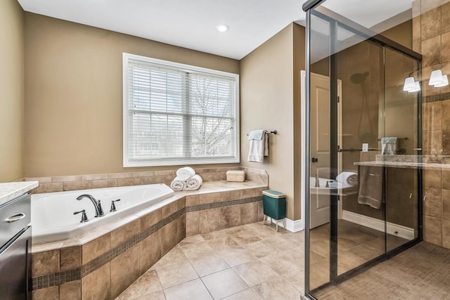 10693 Bear Lake Trl, Portage, MI 49024 - bathroom featuring a bath, a stall shower, and tile patterned flooring