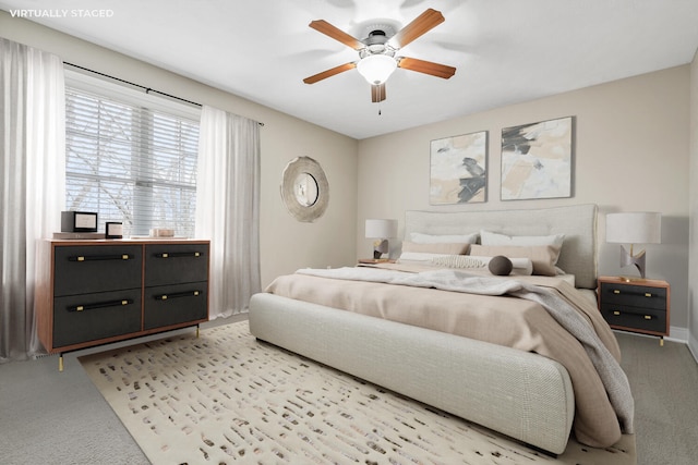 10693 Bear Lake Trl, Portage, MI 49024 - bedroom with light carpet, a ceiling fan, and baseboards